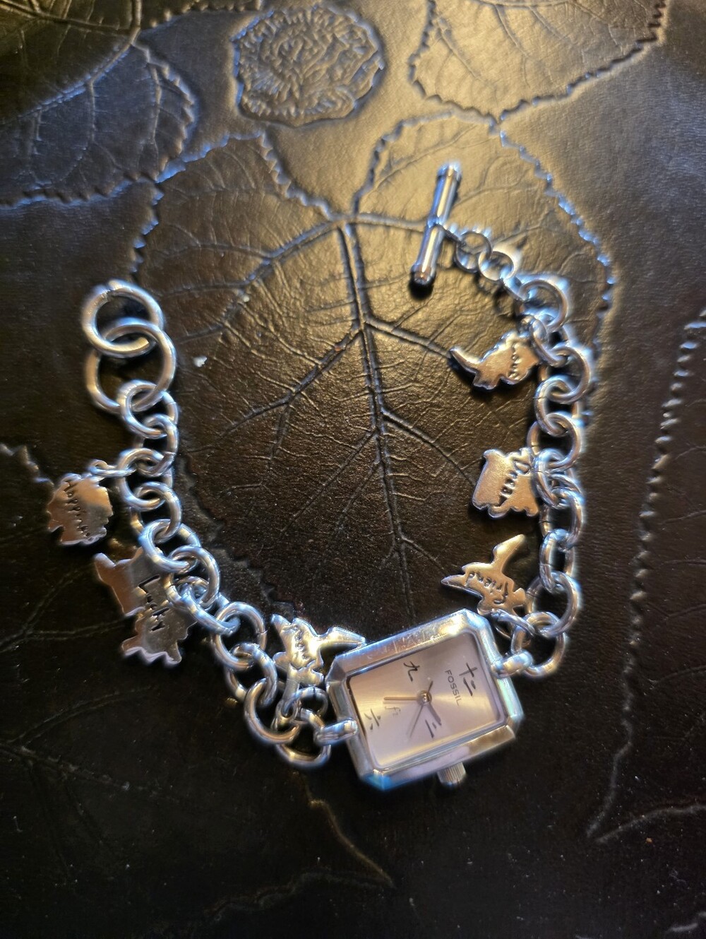 Silvertone FOSSIL Charm Bracelet Watch with Rectangular Face.  In Working Order.